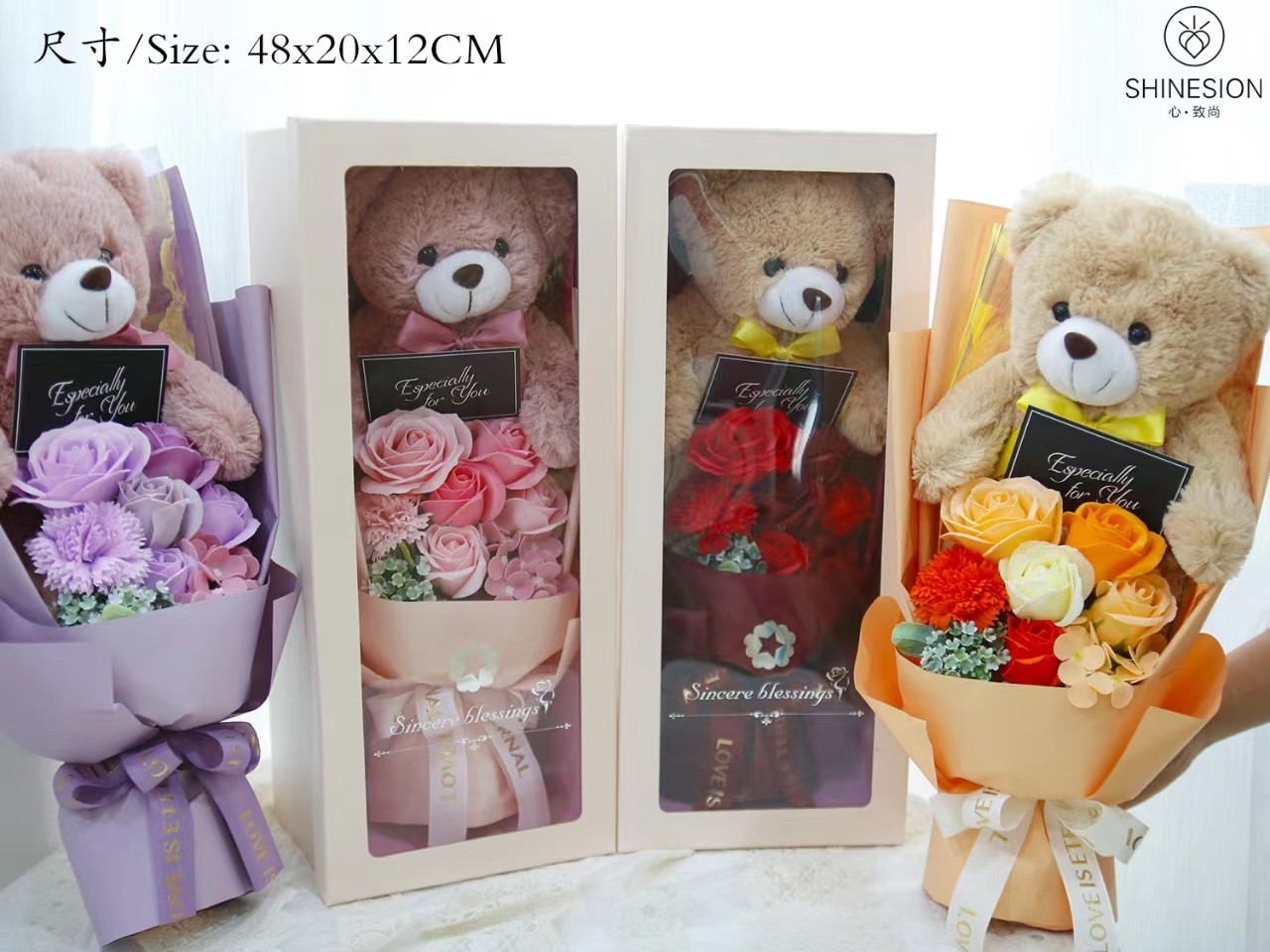 Teddy bear with flower bouquet in gift box